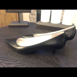 Short heeled black pumps
